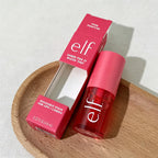 elf sheer for it blush tint with packaging on a wooden plate