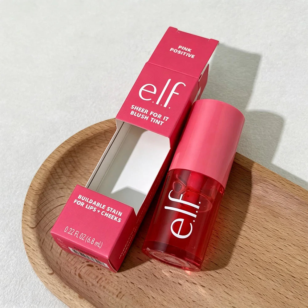 elf sheer for it blush tint with packaging on a wooden plate