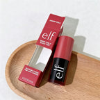 elf Cherry Cola blush tint on a wooden plate with a white background