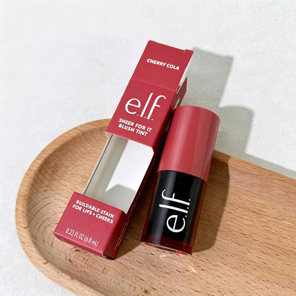elf Cherry Cola blush tint on a wooden plate with a white background